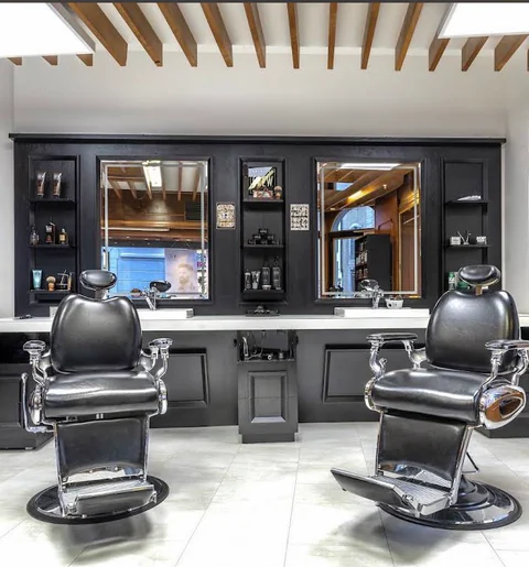 Interior of the Hella salon with two styling chairs.